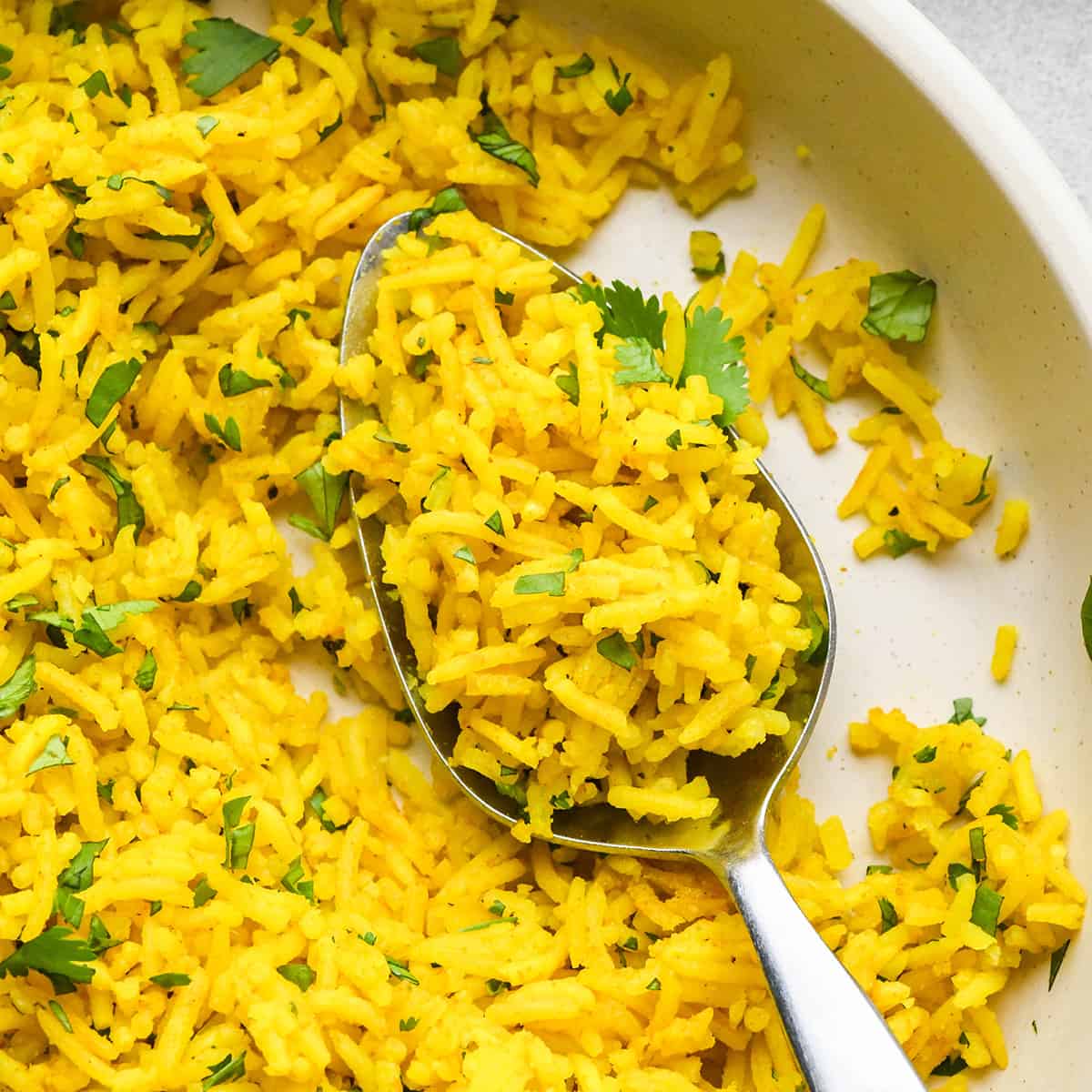 Turmeric Rice in a bowl with a spoon