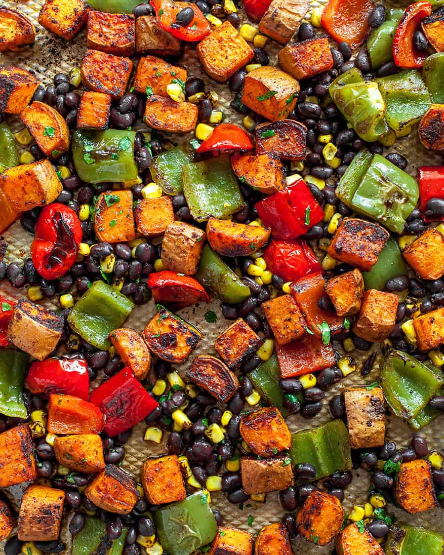 black bean sweet potato tacos on a baking sheet after roasting