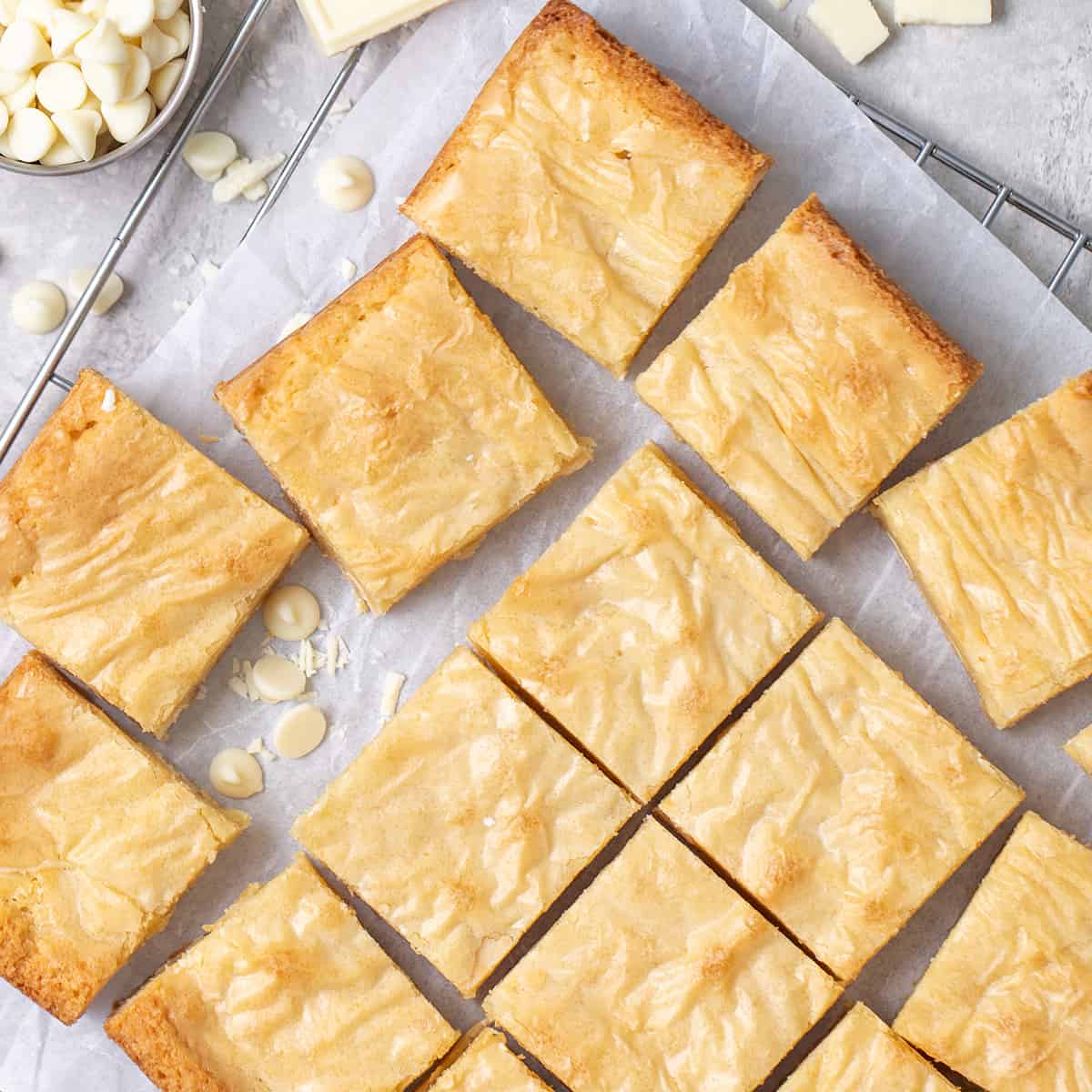 16 White Chocolate Brownies on a cooling rack